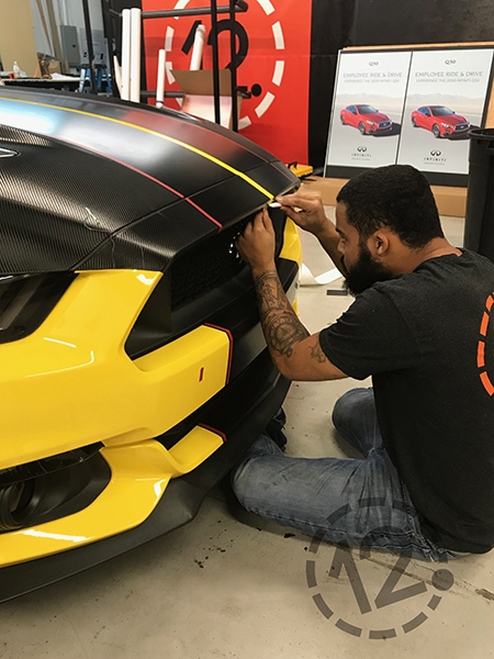 This photo shows the careful detail work we do when applying a stripe kit to a vehicle. 12-Point SignWorks - Franklin, TN