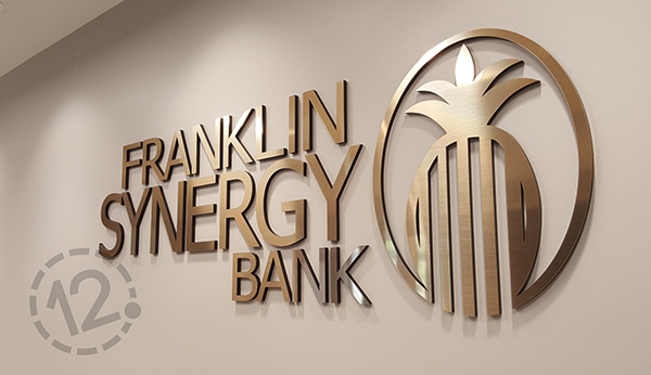 Brushed gold Rowmark and black acrylic were used to create this dimensional sign. 12-Point SignWorks - Franklin, TN