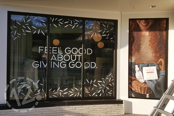 Thistle Farms used their windows to communicate their philanthropic mission. 12-Point SignWorks - Franklin, TN