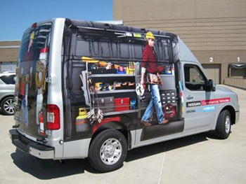 Nissan NV High Roof van with a custom advertising wrap. 12-Point SignWorks