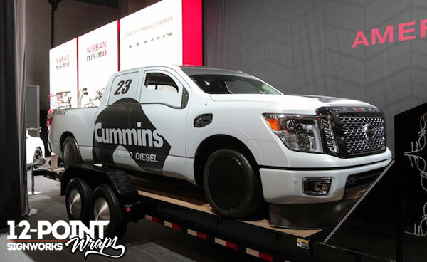 The completed wrap and modifications of the 2016 Nissan TITAN XD at the 2015 SEMA Show in Las Vegas. 12-Point SignWorks