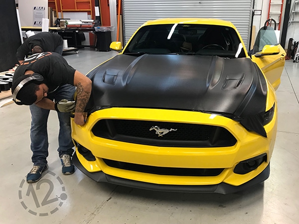 Jamie added black carbon fiber vinyl to the hood, roof, trunk and bumpers of the 2015 Mustang GT. 12-Point SignWorks - Franklin, TN