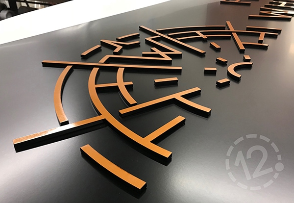 This dimensional sign was created using black satin vinyl, black acrylic and copper metallic vinyl. 12-Point SignWorks - Franklin, TN