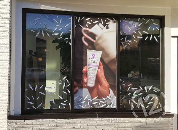 This festive window display beautifully advertises Thistle Farms products! 12-Point SignWorks - Franklin, TN