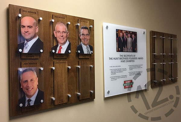 The Hunt Brothers Pizza Founders Award wall display at their Nashville TN headquarters. Custom Signage by 12-Point SignWorks - Franklin TN