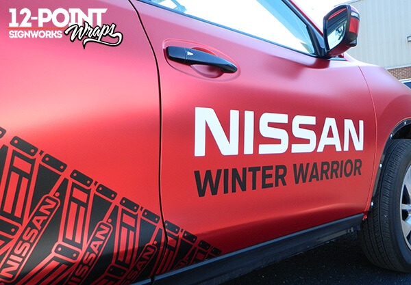 A glimpse of the snow track pattern and the Nissan and Winter Warrior logos on the Nissan Rogue. 12-Point SignWorks