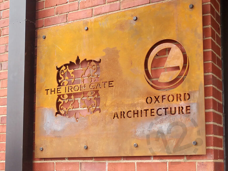 Corten steel signage for The Iron Gate and Oxford Architecture. 12-Point SignWorks - Franklin, TN
