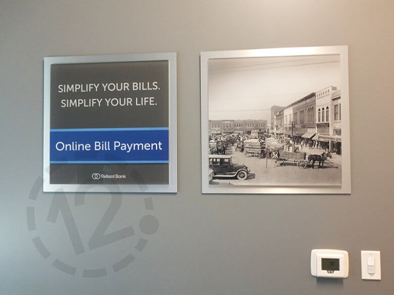 Branded product display and acrylic photo display for Reliant Bank in Murfreesboro. 12-Point SignWorks - Franklin, TN