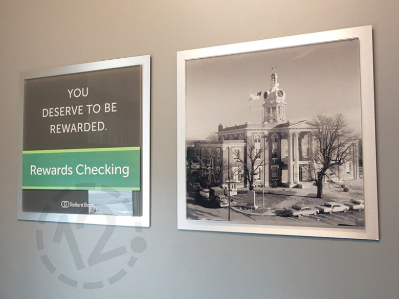 Branded product display and acrylic photo display for Reliant Bank in Murfreesboro. 12-Point SignWorks - Franklin, TN