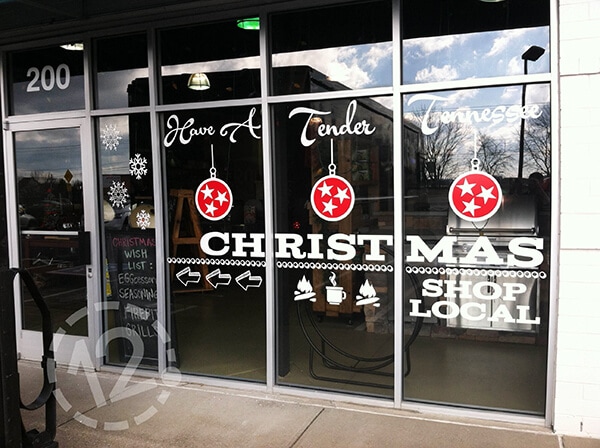 Cut vinyl window graphics for Embers Grill & Fireplace Store by 12-Point SignWorks in Franklin, TN.
