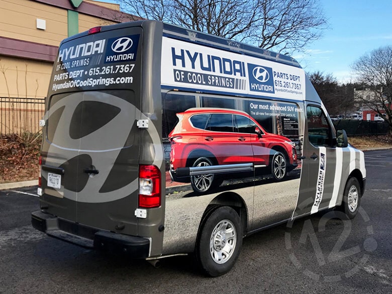 Custom van wrap for Hyundai of Cool Springs in Franklin, TN by 12-Point SignWorks.