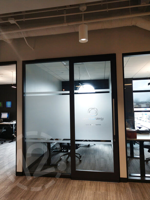 Custom window film for E|SPACES tenants in downtown Franklin by 12-Point SignWorks. 