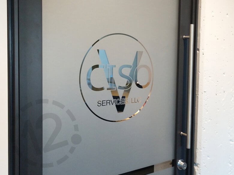 Custom window film for businesses at E|SPACES in downtown Franklin by 12-Point SignWorks. 