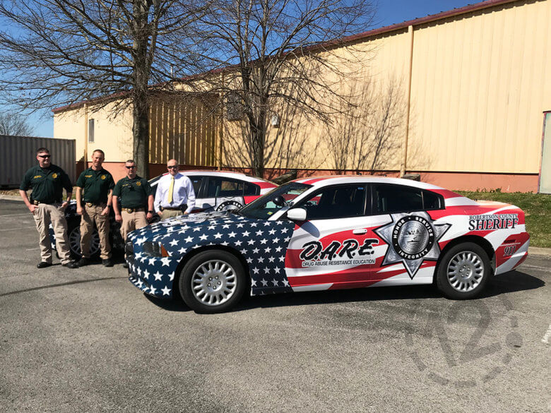 Custom car wraps for the Robertson County Sheriff's Office by 12-Point SignWorks in Franklin, TN.