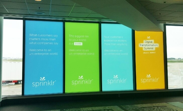 Airport window graphics for Sprinklr installed by 12-Point SignWorks at the Nashville International Airport. 