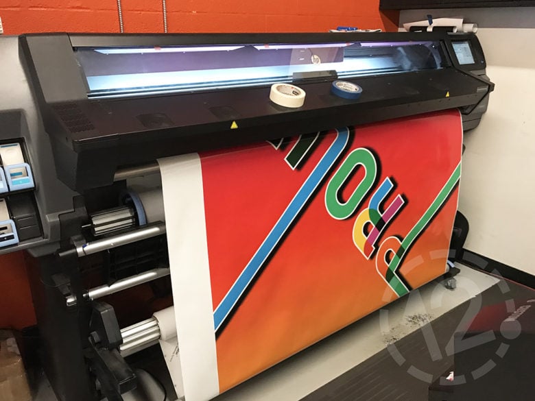 Printing Nissan's PROUD car wrap by 12-Point SignWorks.