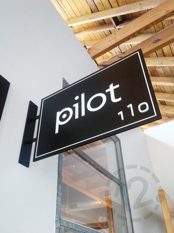 Custom suite ID sign for Pilot in the Sawtooth building fabricated by 12-Point SignWorks.