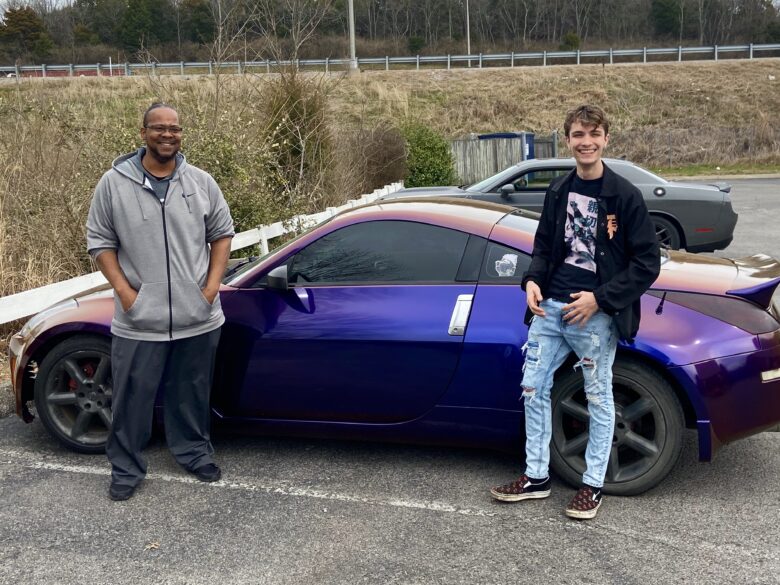 Our Creative Director Torrence and Devin with the Completed Custom Vehicle Wrap
