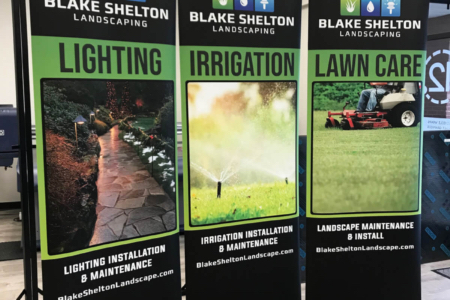 Blake Shelton banner with landscapping on three banners.