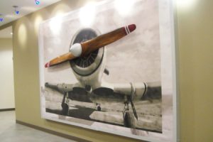 Ascend Federal Credit Union airplane mural with wooden propeller