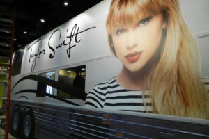 Taylor Swift tour bus wrap with image and signature